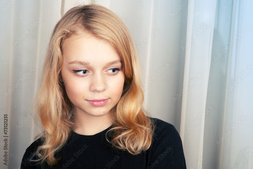 Smiling blond Caucasian girl, studio portrait Smiling blond Caucasian girl, studio portrait