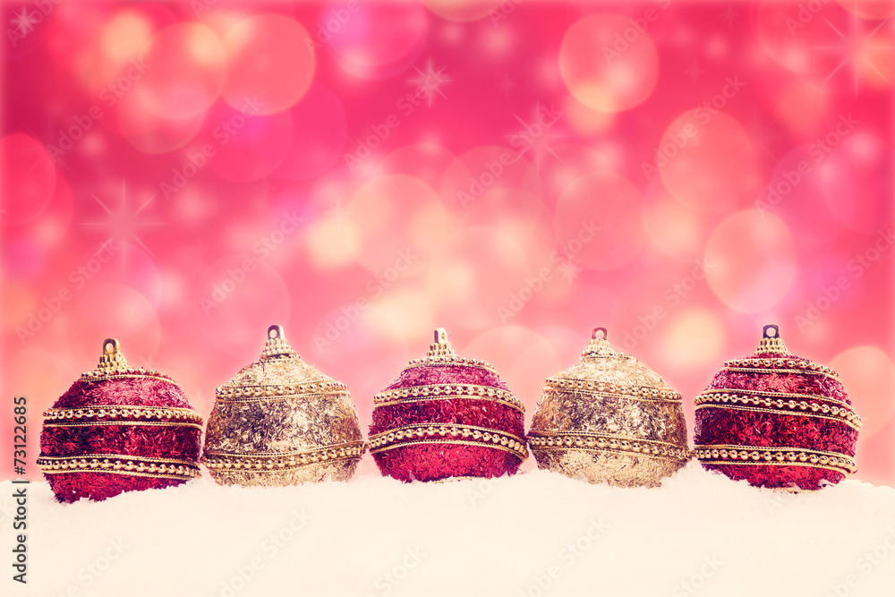 Christmas balls in snow, christmas background with bokeh Christmas balls in snow, christmas background with bokeh