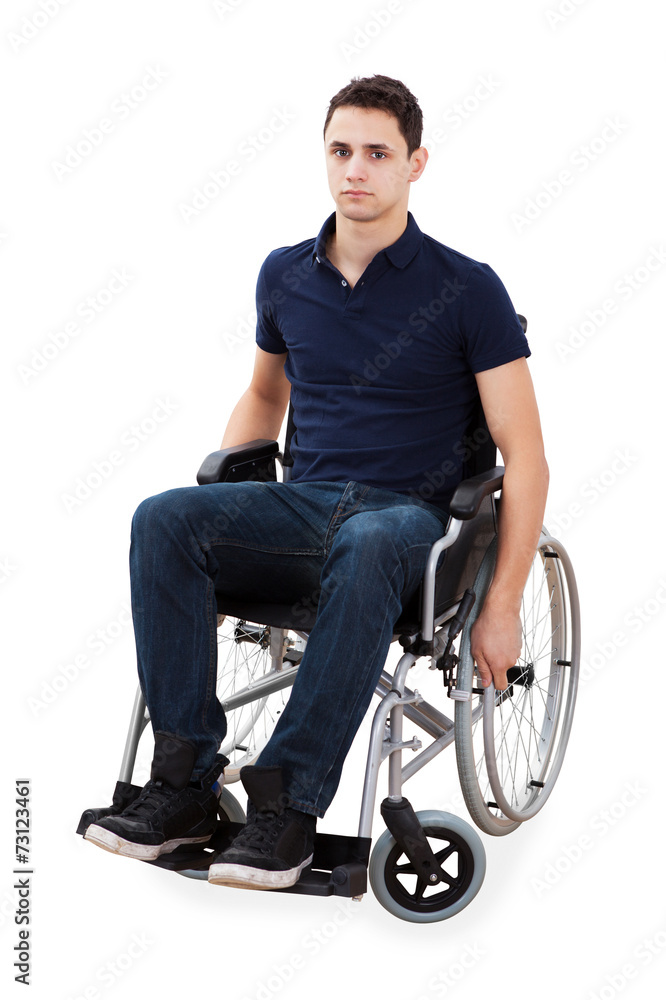 Portrait Of Confident Man Sitting In Wheelchair
