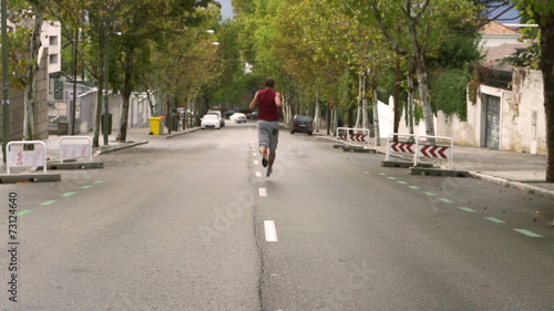 Wallpaper Mural Man jogging alone on the road, slow motion 240fps, steadycam Torontodigital.ca