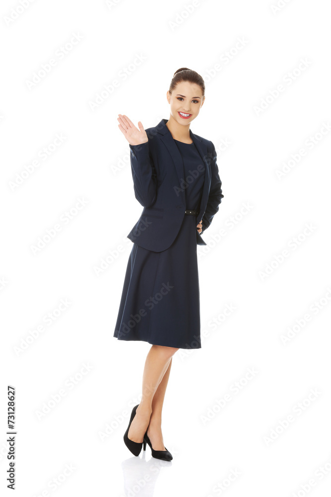 Business woman waving