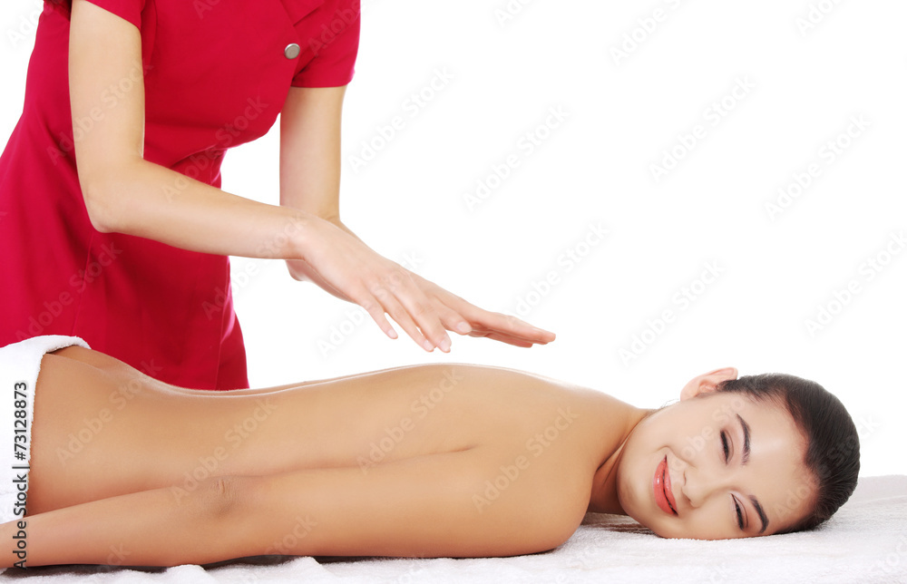 Obraz premium Young woman massage in spa