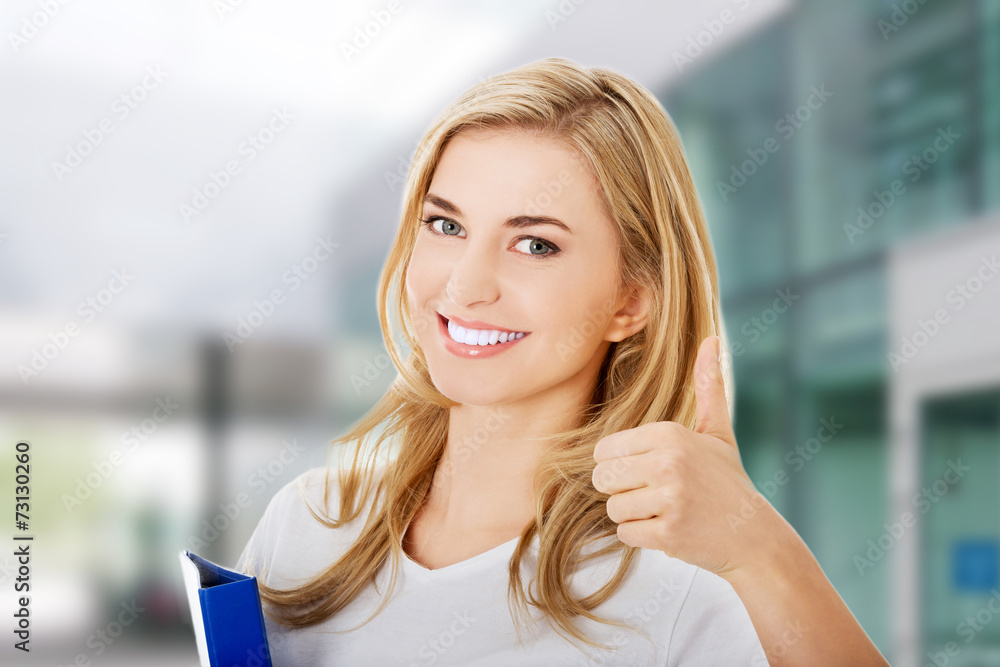 Happy woman with ok hand sign