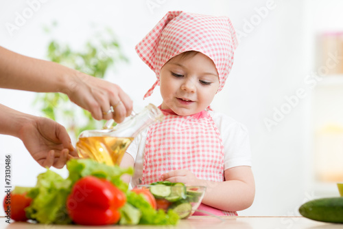little girl with vegetables...