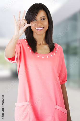 Woman posing in pink shirt