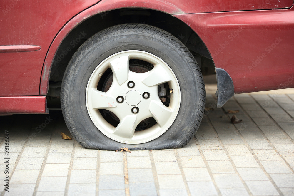 flat tyre on car wheel 