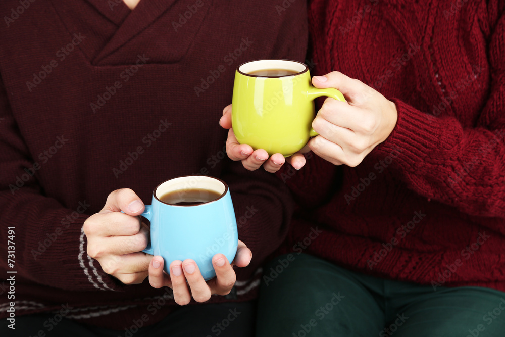 Loving couple with hot drinks Loving couple with hot drinks