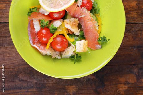 Fresh fish salad with vegetables