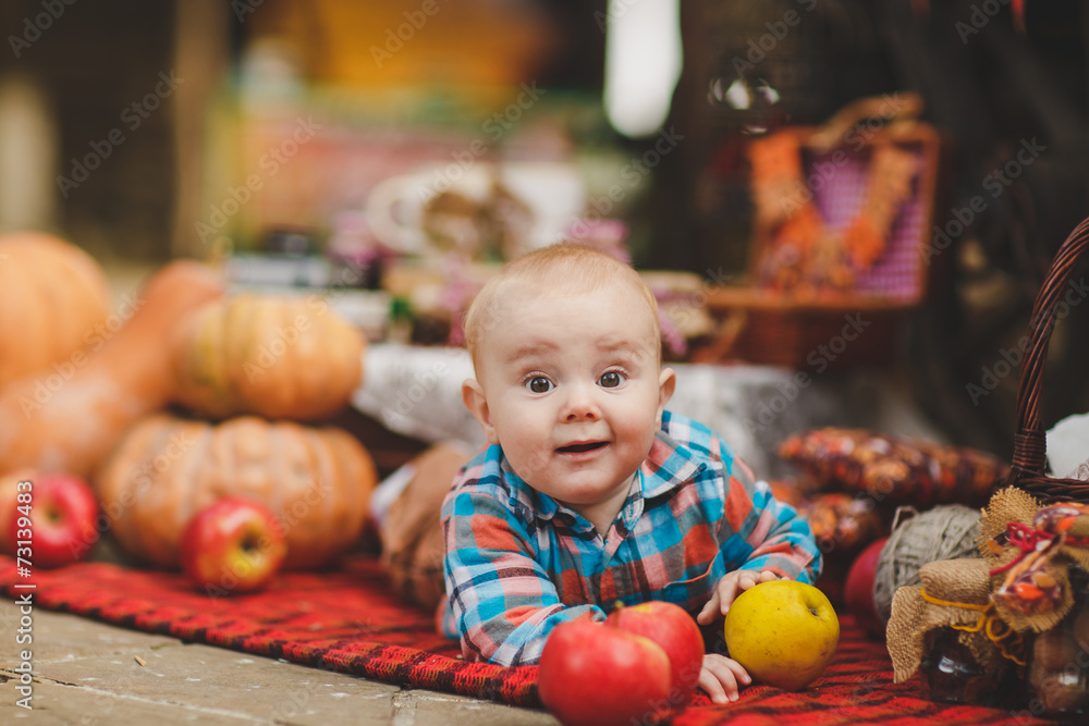 Fototapeta premium kid playing in the yard of his house in the village