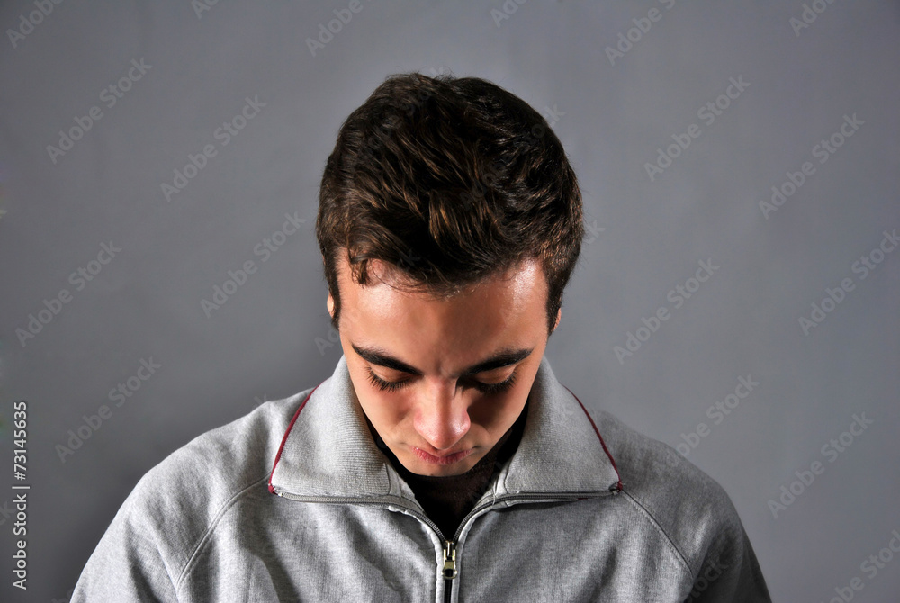 young man with a face of concern young man with a face of concern