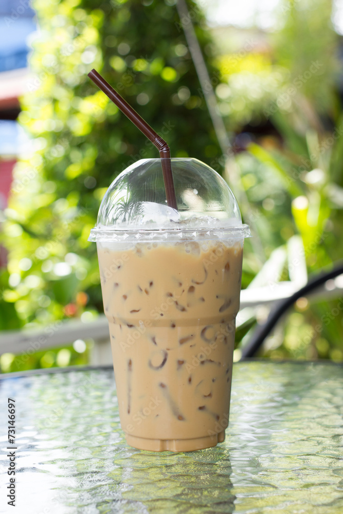 Iced coffee with straw in plastic cup Iced coffee with straw in plastic cup