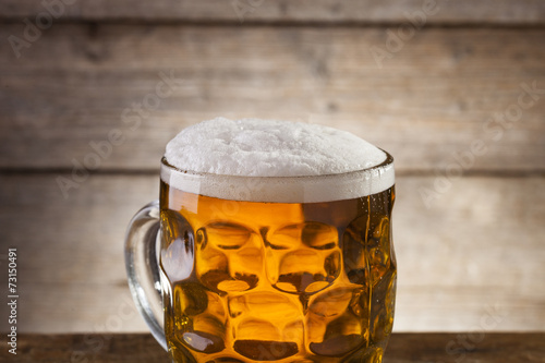 Beer on a wooden background with copy space
