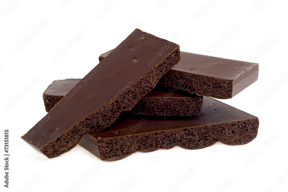 Porous dark chocolate, close-up Porous dark chocolate, close-up