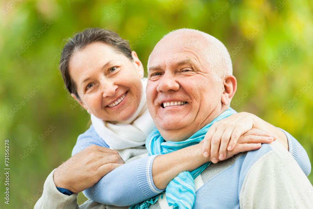 Fototapeta premium Happy mature couple in autumn park