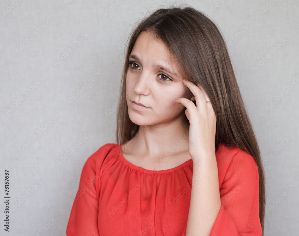 Beautiful young attractive woman  holding her chin