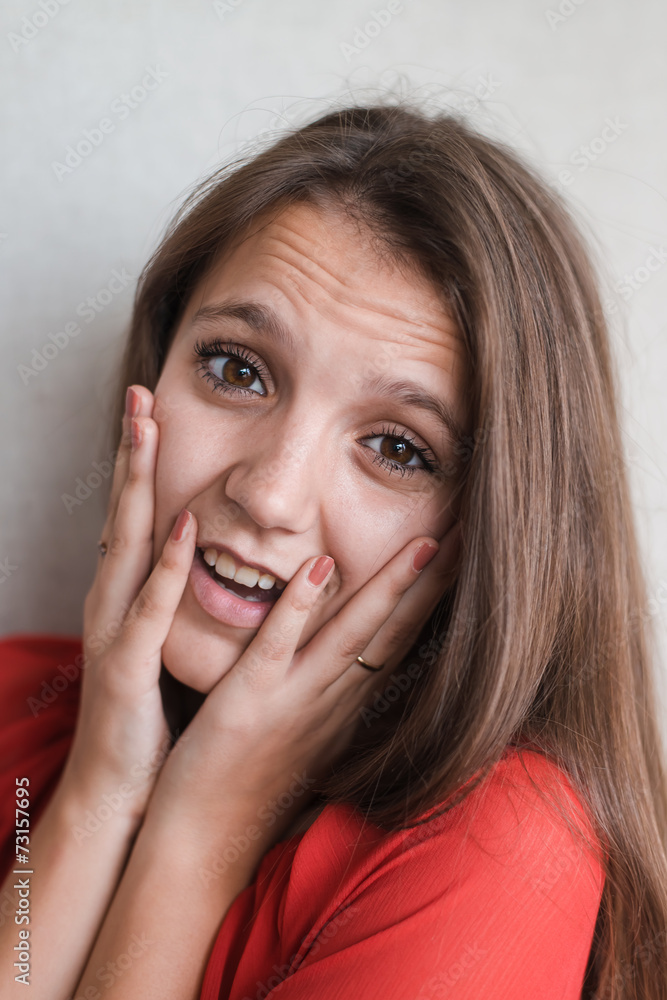 Woman with headache holding head with hands Woman with headache holding head with hands