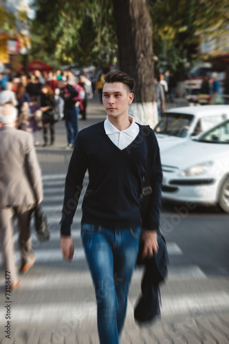 Young man cross the street © arthurhidden