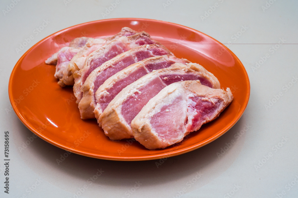 Raw sliced pork in the orange dish - Ingredient Raw sliced pork in the orange dish - Ingredient