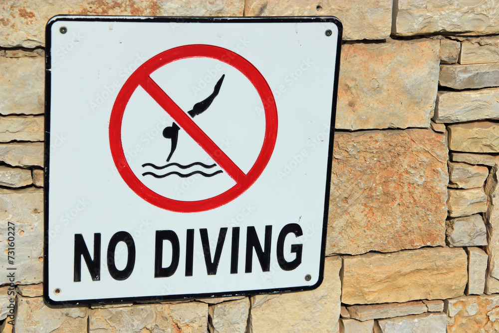 Sign for no diving symbolizing danger, safety and vacations Sign for no diving symbolizing danger, safety and vacations