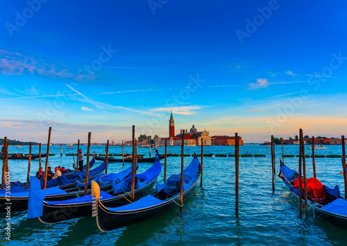 several Gondolas docked at Venice Italy. Sunset time © imagIN photography