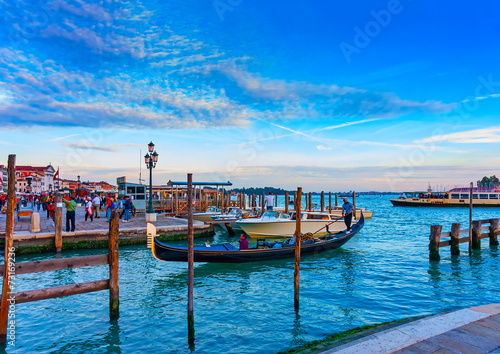 several Gondolas docked at Venice Italy. Sunset time © imagIN photography