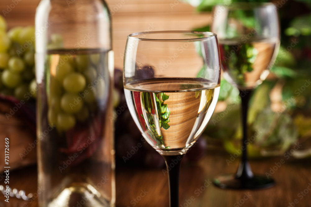 Bottle and glasses of white wine Bottle and glasses of white wine