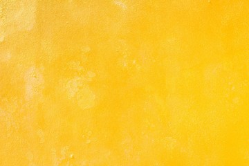 Yellow grunge cement wall, textured background