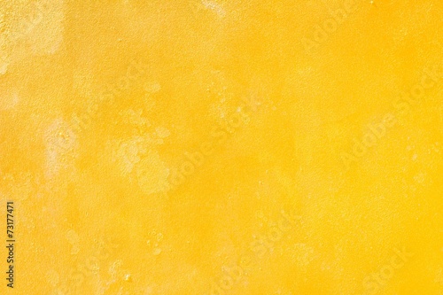 Yellow grunge cement wall, textured background
