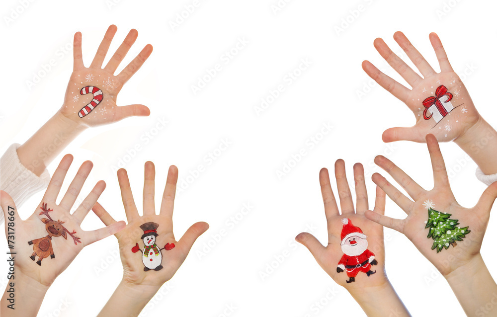 Children's hands raising up with painted Christmas symbols: Sant Children's hands raising up with painted Christmas symbols: Sant