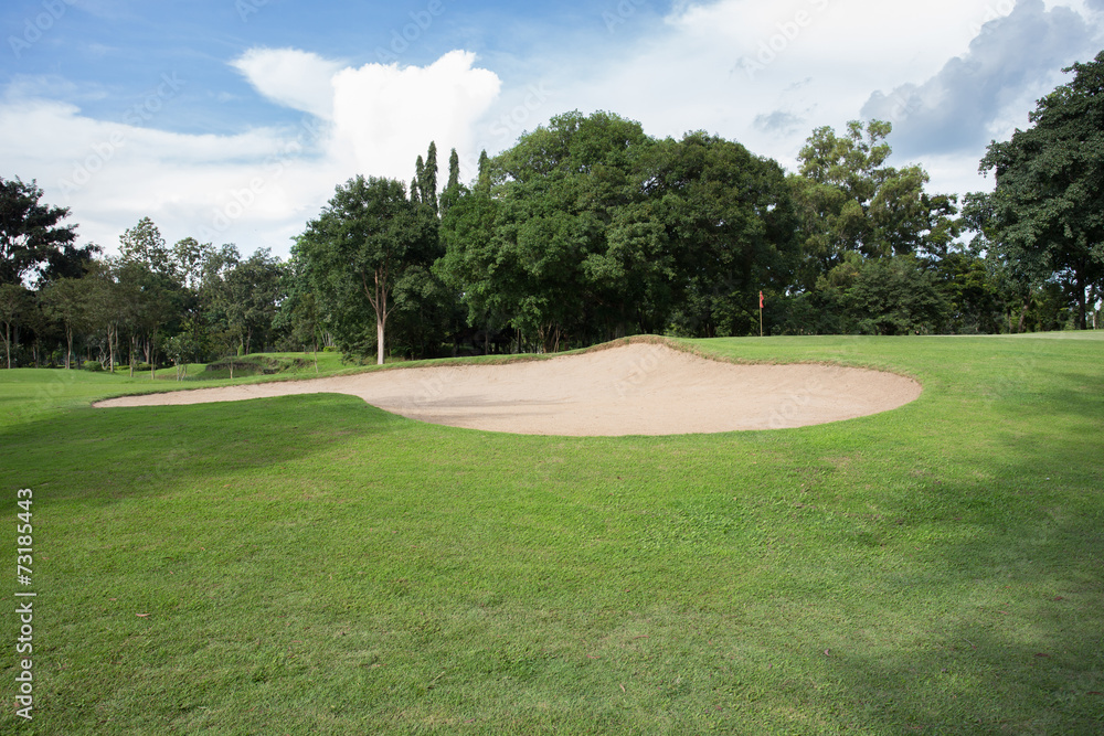 golf course with sand bunker and green grass golf course with sand bunker and green grass