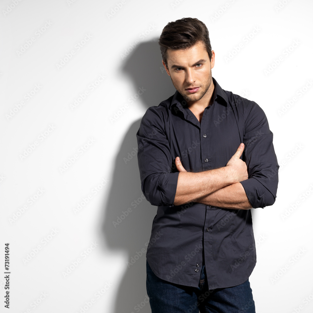 Fashion portrait of young man in black shirt Fashion portrait of young man in black shirt