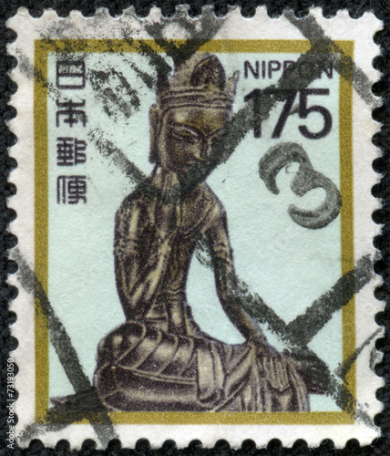 stamp printed in Japan shows a bronze statue of Maitreya photo