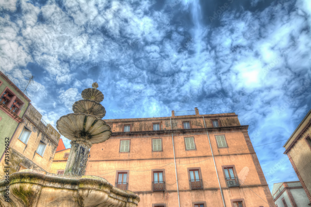 Obraz premium fountain and buildings in hdr