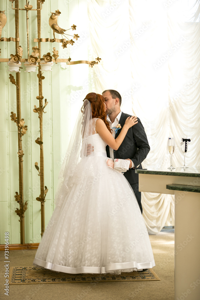 newly married couple kissing at registry office newly married couple kissing at registry office