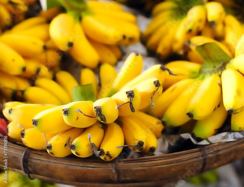 Photography Shallow depth of field photography of ripe yellow bananas on loc