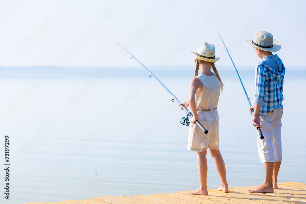 Boy and girl with fishing rods