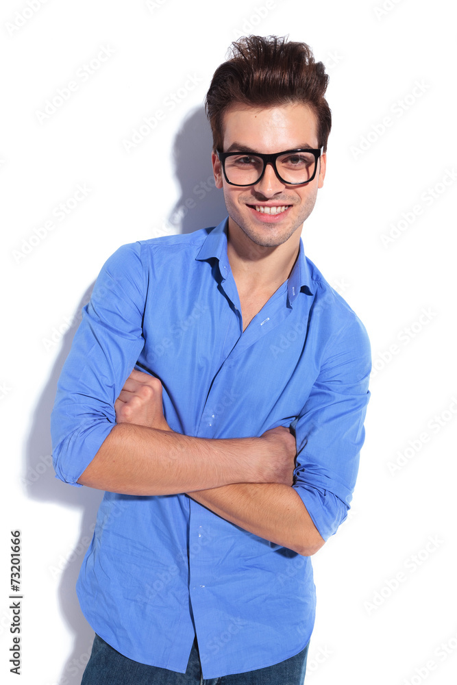 handsome business man leaning on a white wall handsome business man leaning on a white wall