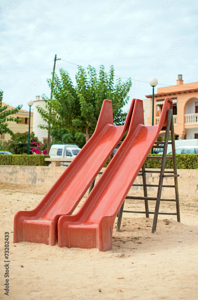 Modern children playground slide in city park. Modern children playground slide in city park.
