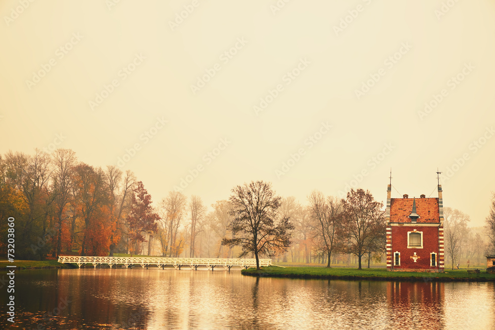 Fototapeta premium Chapel in autumn park
