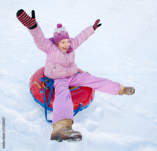Konstfotografi Child sledding in winter hill