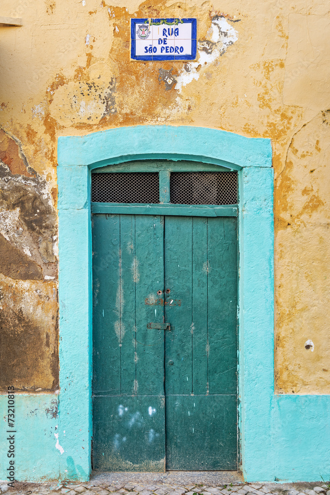 Typical green doorway in the old town of Olhao