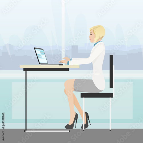 business woman sitting desk office working laptop computer
