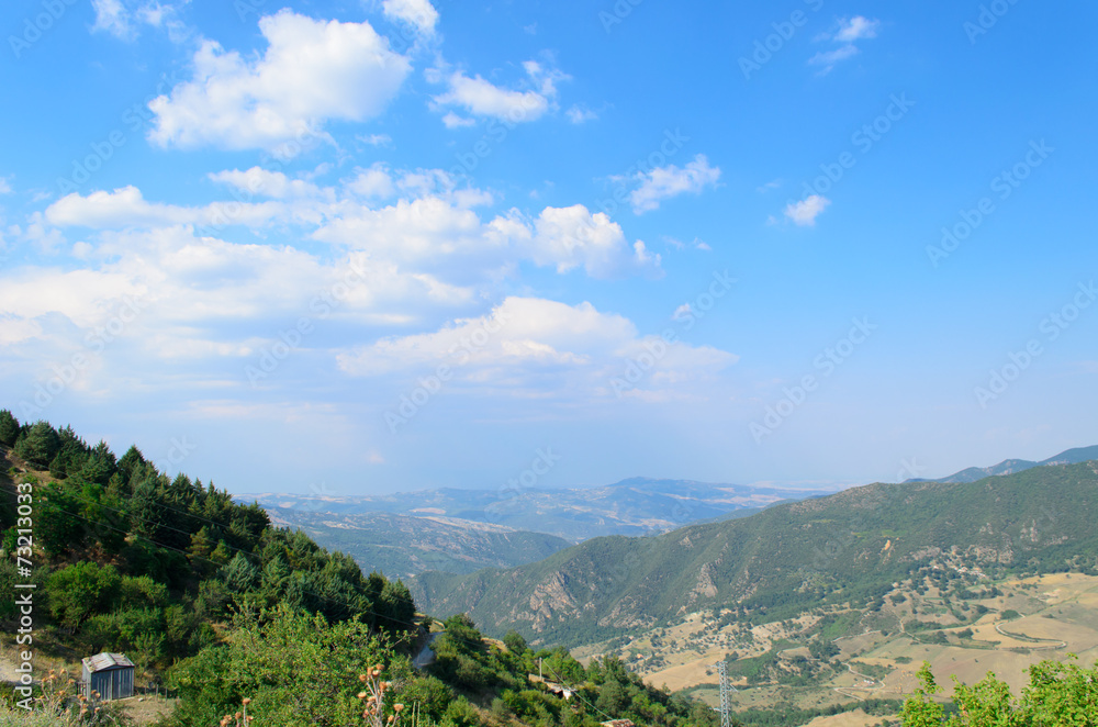Mountain landscape in Basilicata with blue sky and clouds