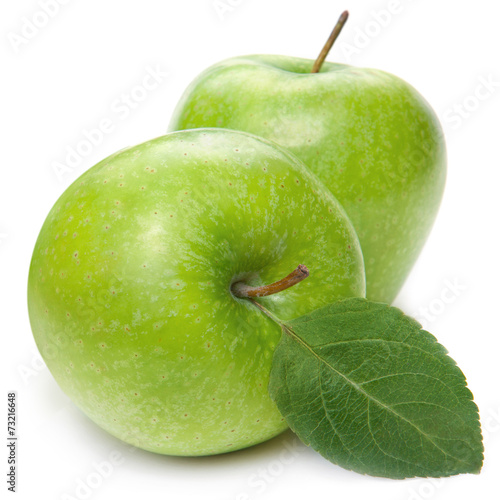 Green apple fruits and green leaves isolated on white background