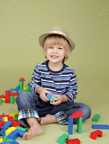 Child Playing with Blocks, Clothing and Fashion photo