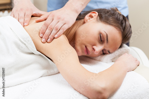 Woman having arm massage in spa