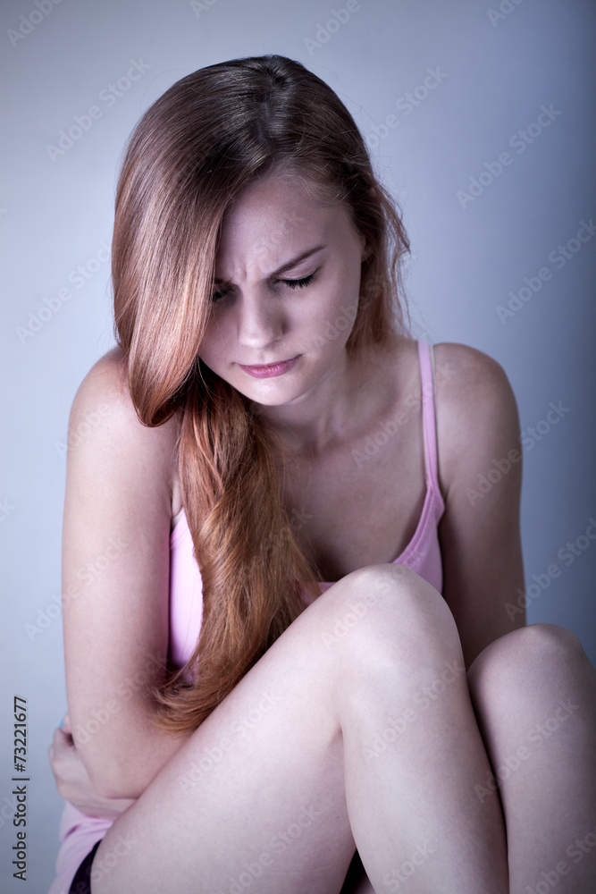 Fototapeta premium Portrait of young suffering woman