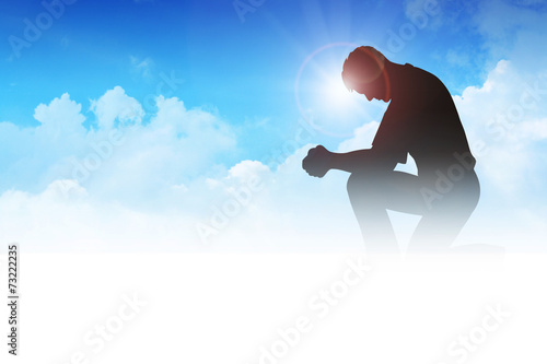 Silhouette illustration of a man praying among the clouds