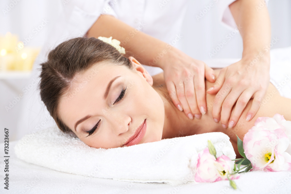 Beautiful young woman having massage in spa salon Beautiful young woman having massage in spa salon