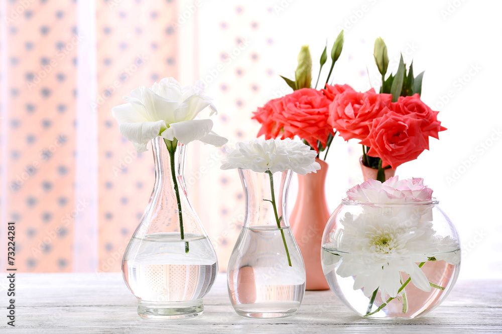 Beautiful flowers in vase with light from window - obrazy, fototapety, plakaty 